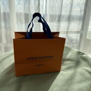 Authentic Louis Vuitton Small bag 5.5 x 4.5 Classic Orange color.